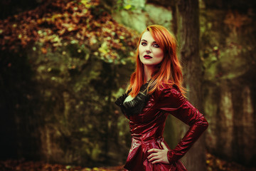 red head girl with fetish jacket outdoor pose