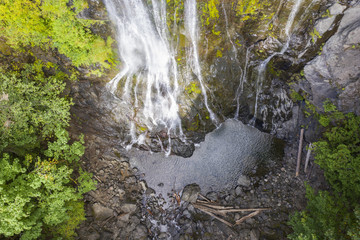 Aerial drone view of a beautiful waterfall and lake