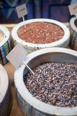 Close up of raw mixed purple, black rice in a bowl. Rich in nutrients and is a good source of vitamins, minerals, antioxidant, high in fiber. Healthy eating and eat well concept. Mock up label ready.