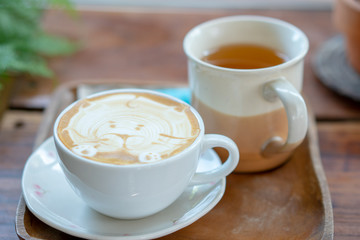 Hot coffee cup on wooden table