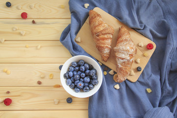 A nutritious healthy breakfast of croissants and fresh juice