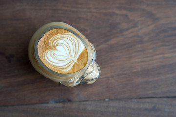 Hot coffee skull cup on wooden table