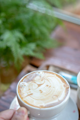 Hot coffee cup holder with hand