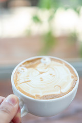 Hot coffee cup holder with hand