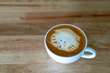 Hot coffee cup on wooden table