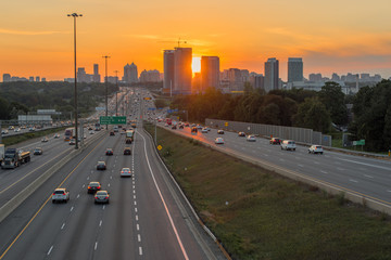 View of busy Highway 401 in Toronto, Canada at the sunset
