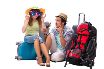 Obraz na płótnie Canvas Young family preparing for vacation travel on white