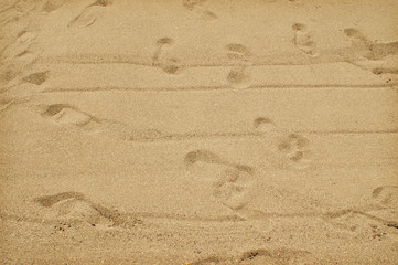 Sand with footprints background