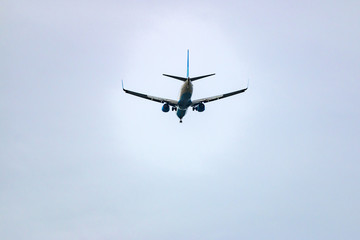 Fototapeta na wymiar airplane flies away