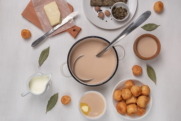 Asian traditional dish. Mongolian, Kalmyk, Buryat, Tibetan, Tuvan tea. Tea with milk, salt, butter, nutmeg, Bay leaf, black pepper. Cuisine of nomadic peoples.