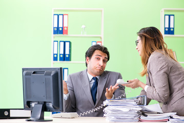 Two colleagues working in the office