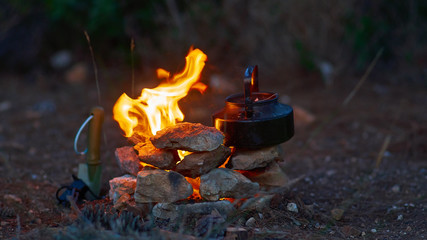 Fire in fireplace and kettle