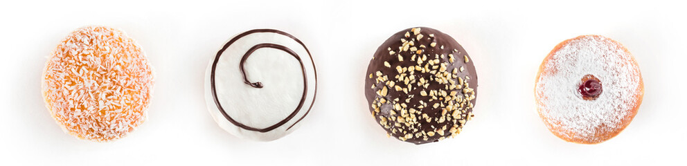 Set of delicious and assorted doughnuts isolated on white background, view from side