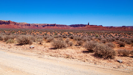 Iconic Southwest US desert brown sandstone monument in the former Bears Ear National Monument located in the Valley of the Gods, Mexican Hat, Utah