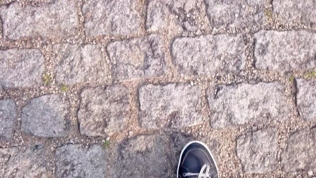 walking on a cobblestone street
