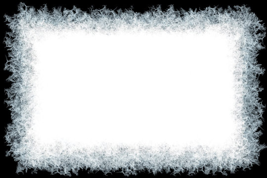 Decorative ice crystals frame on black matte background