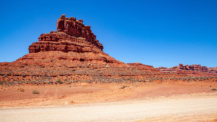 Iconic Southwest US desert brown sandstone monument in the former Bears Ear National Monument located in the Valley of the Gods, Mexican Hat, Utah