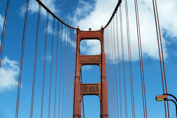 Golden Gate Bridge, San Francisco - red steel structure against bright blue sky