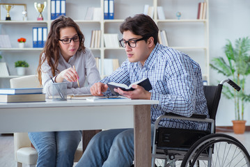 Disabled student studying and preparing for college exams