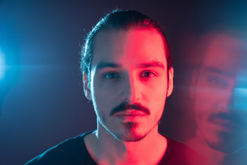 Cinematic portrait of man with lights and prism