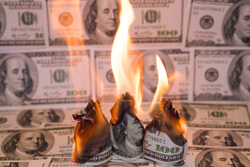 Burning one hundred dollar