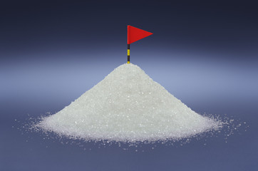 Sugar mound with level scale and red flag on blue background, suggesting health concern of consuming high amount of sugar