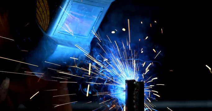 Blacksmith using a welding torch 4k