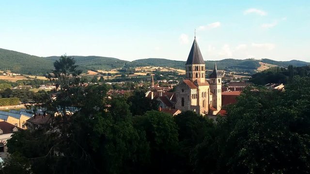 Revealing shot of small town in France, Cluny