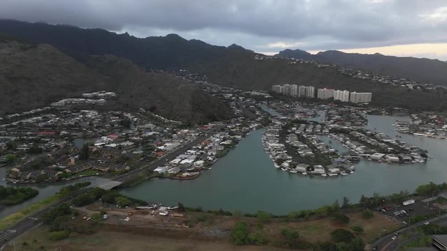 Sunset on the coast of Honolulu in Hawaii. Boats, Jets Skis, and Cars