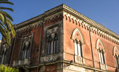 Fototapeta premium Arab-Norman architecture - upper storey of house with Venetian style arched windows on Ortigia Island Syracuse, Sicily, Italy