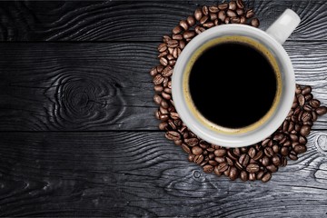 Obraz na płótnie Canvas Cup of hot coffee with beans