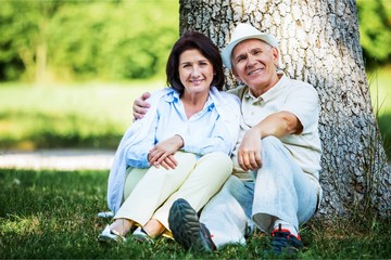 Happy mature couple in the park in