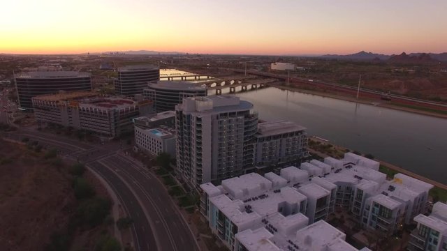 aerial drone footage of tempe town lake in arizona at sunset