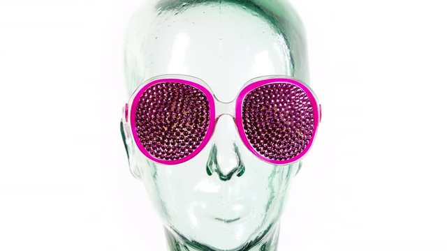 mix of clear glass mannequin head anda skull with amazing changing collection of sunglasses and shades
