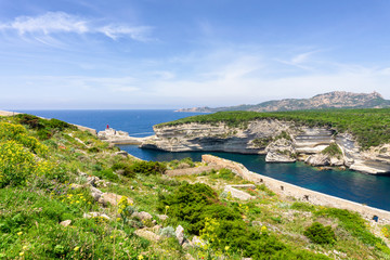 Landscape on Corsica island, Beautiful top view of Calvi town with castle on hill in summertime, France