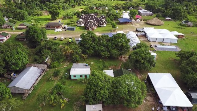 A Brazillian village Nova Morada in the state of Acre, beside the Envira river with boats, Drone shot