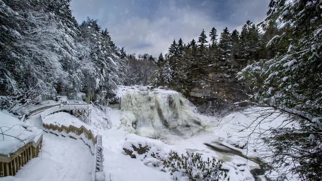 Cinemagraph of Blackwater Falls in winter with ice and snow while lightly snowing.