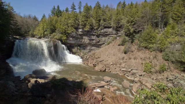 Black and white, cinemagraph of Blackwater Falls pours water through a gorge in West Virginia.