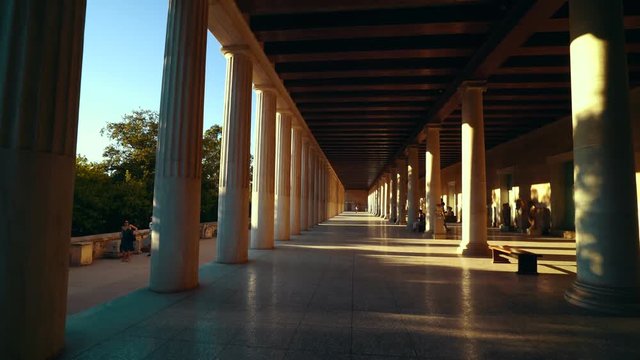 Walking between the Columns at the entrance of the Temple of Hephaestus in Athens