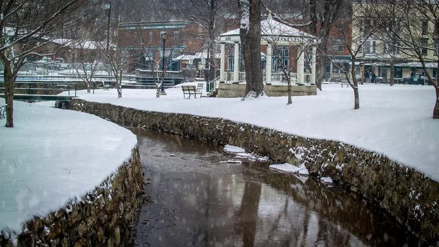 Cinemagraph of the gazebo in Berkeley Springs, WV state park with snow falling and creek flowing.