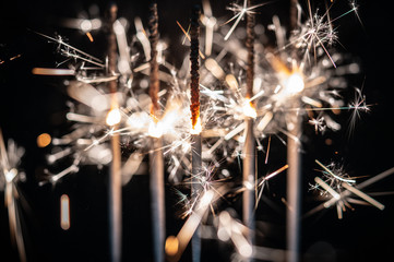 Fireworks , sparklers ,bursting against a black background