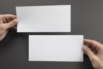 Fototapeta premium Mens hands holding white flyers