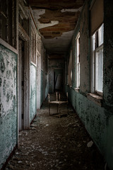 Fototapeta na wymiar Narrow Derelict Hallway - Abandoned Hospital for Chest Diseases - New Jersey
