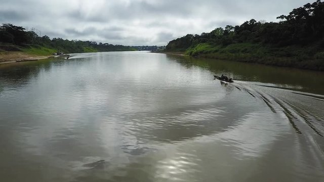 A single speed boat sailing on the Envira river in a Brazillian village Nova Morada, Aerial view