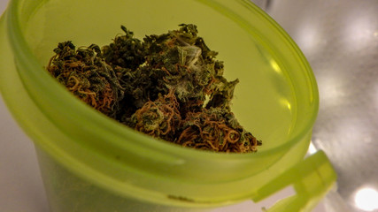 Close up of the top of a RX bottle filled with medical marijuana that is about to be sold in pharmacies nation wide in Canada