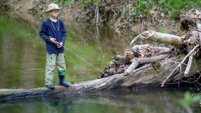 Cinemagraph of a boy fishing on a creek.