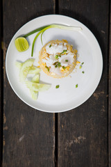Fried rice with Squid on the wooden table from top view