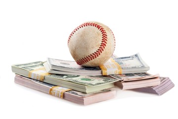 Baseball and stacks of cash