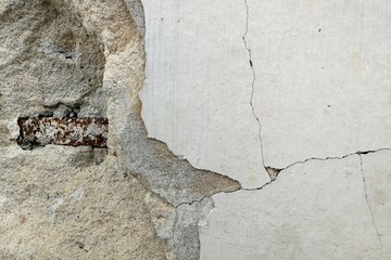 steel in broken cement wall