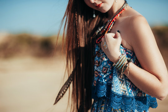 close up of attractive young woman wearing boho accessories